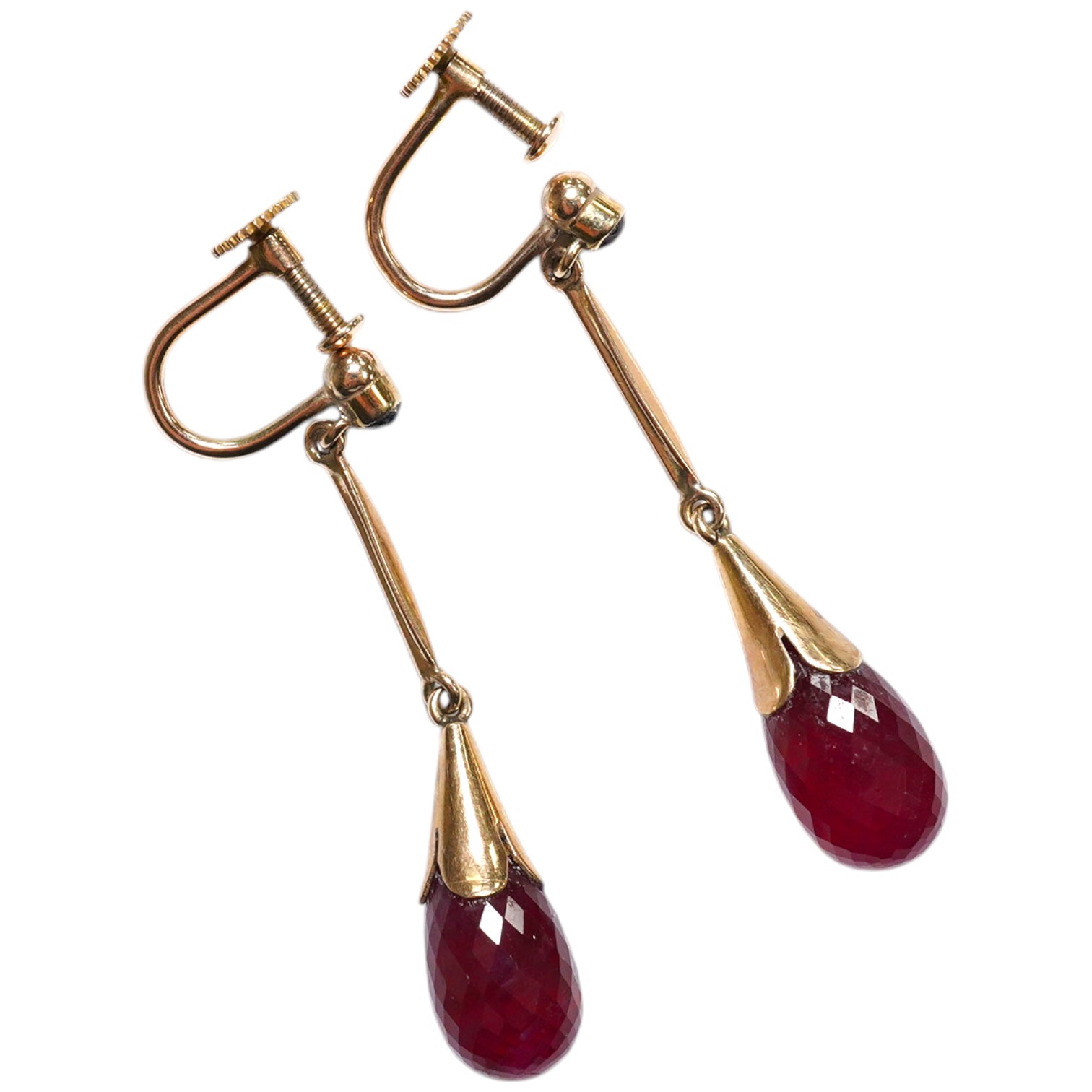 A pair of 9ct and facetted cut oval ruby set drop ear clips, 35mm. Condition - fair